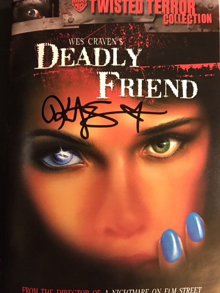 Kristy Swanson signs cover of "Deadly Friend" DVD